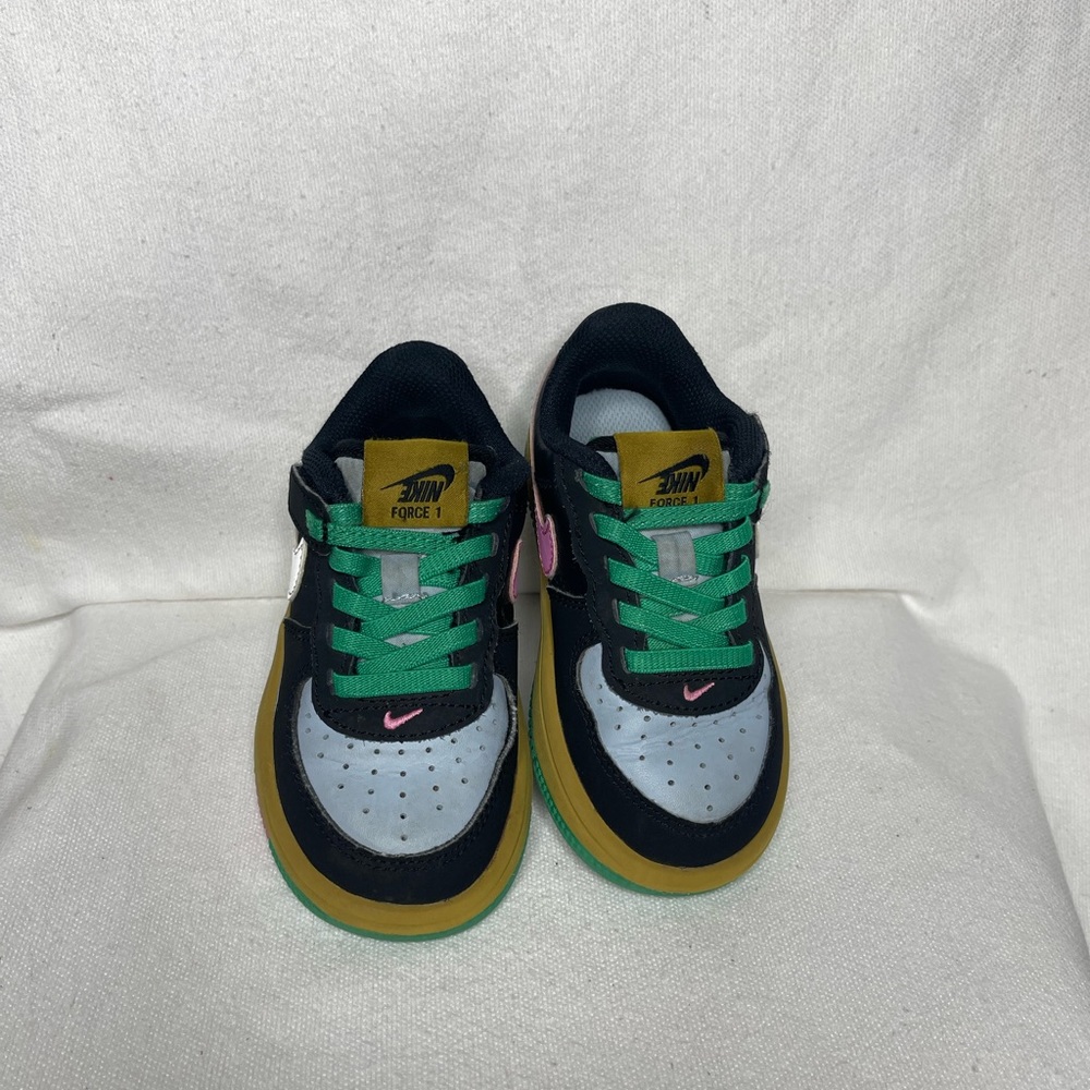Nike Kids Black and Gold Sneakers with Pink Accents